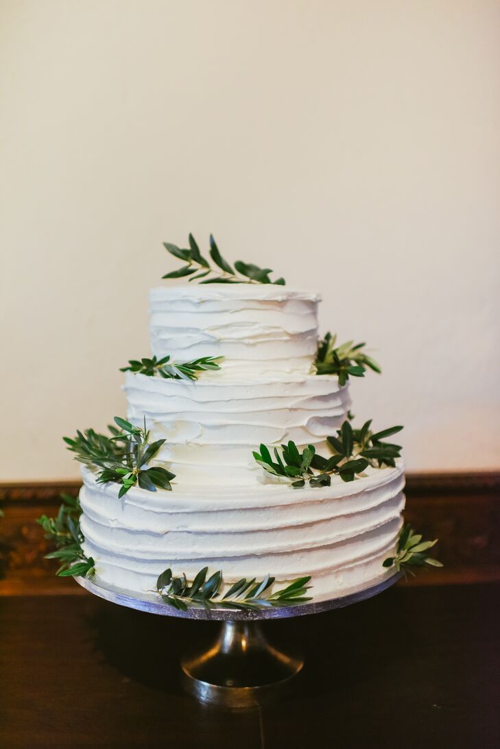 White Buttercream Cake Topped With Olive Branches