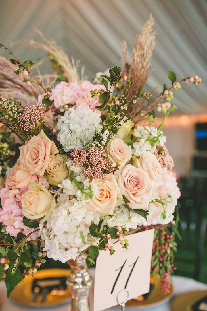 "We ordered special glassware that had a vintage and almost regal feel to really showcase the florals for my centerpieces," Elle says. "Each piece was different, which made the atmosphere amazing."