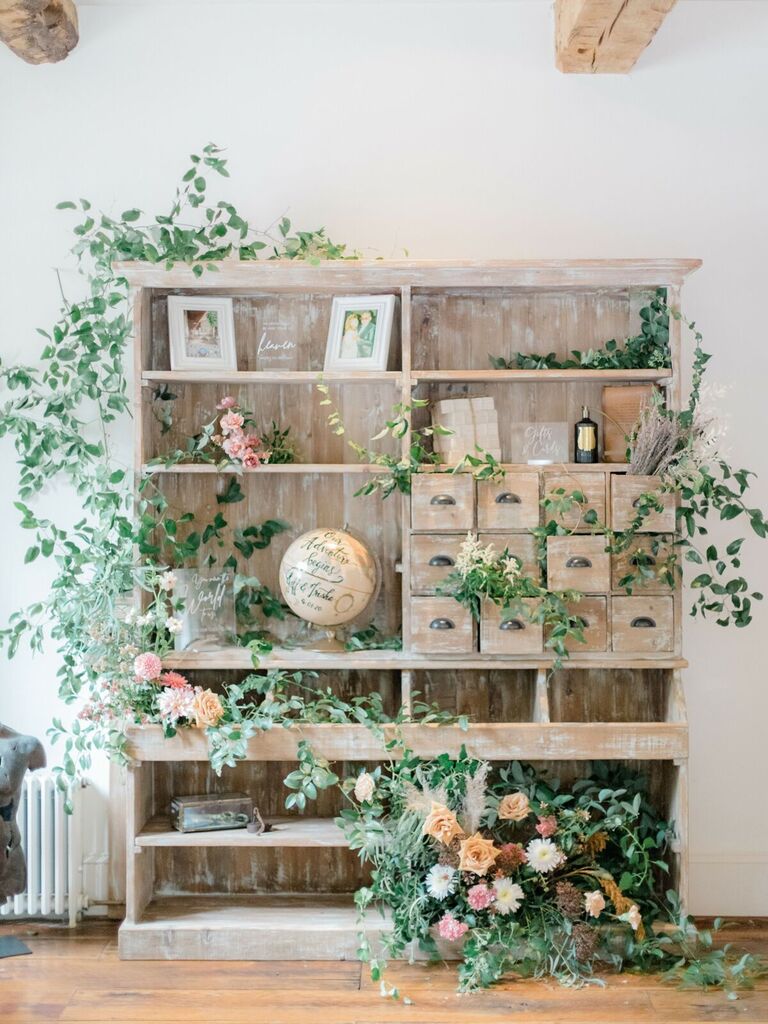Fairytale-themed wedding gift area with greenery