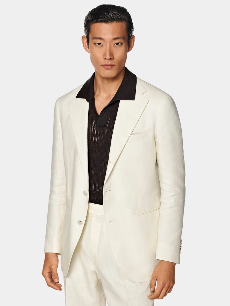 Off white 70s-inspired suit by SuitSupply. 
