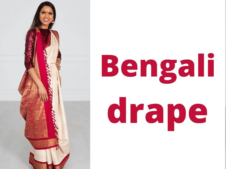 Tia Bhuva wearing a white and red saree in a Bengali drape.