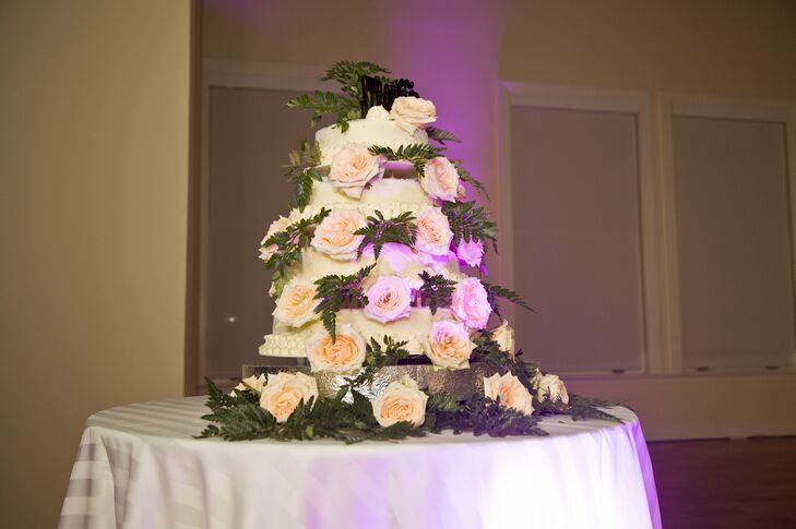 The white wedding cake was covered in blush roses and ferns. Jennie and Patrick chose a carrot cake for their wedding cake.