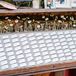 The couple pinned traditional escort cards to a board laid over a repurposed wooden piano.