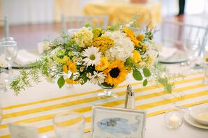 Bright Centerpiece with Sunflowers and Daisies on Striped Table Runner