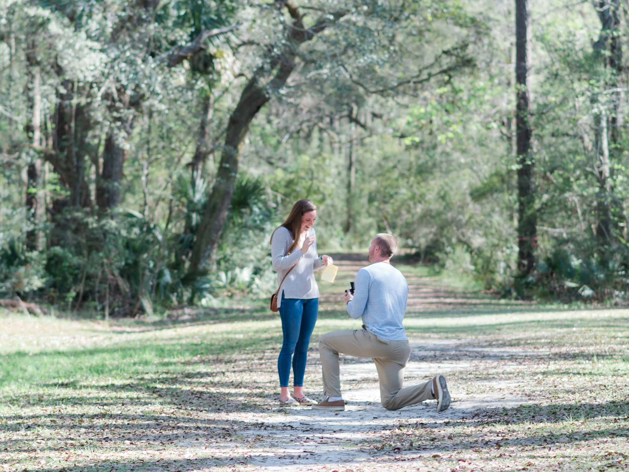 Man proposing to woman at Laurel Hill County Park in Charleston, South Carolina