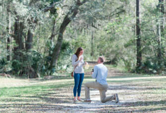 Man proposing to woman at Laurel Hill County Park in Charleston, South Carolina