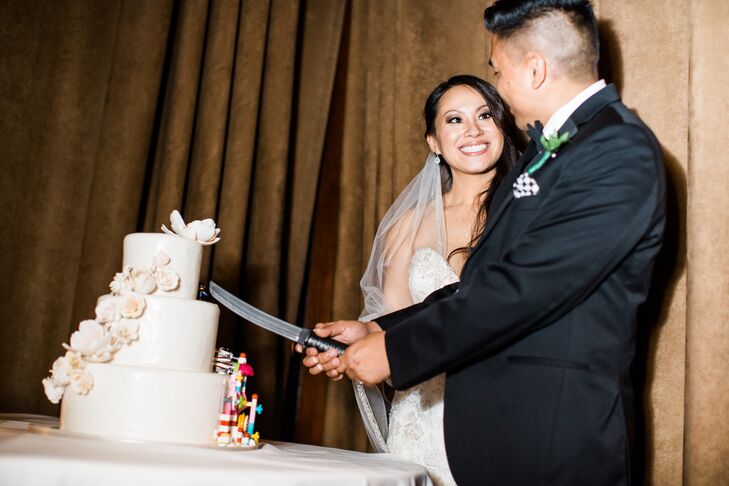 The overall theme of the wedding was black tie was a classy tribute to Kathy's elegant grace. For Jon, fun features were included like his checkered shoes and their half Lego cake which he cut with a miniature Samurai sword.