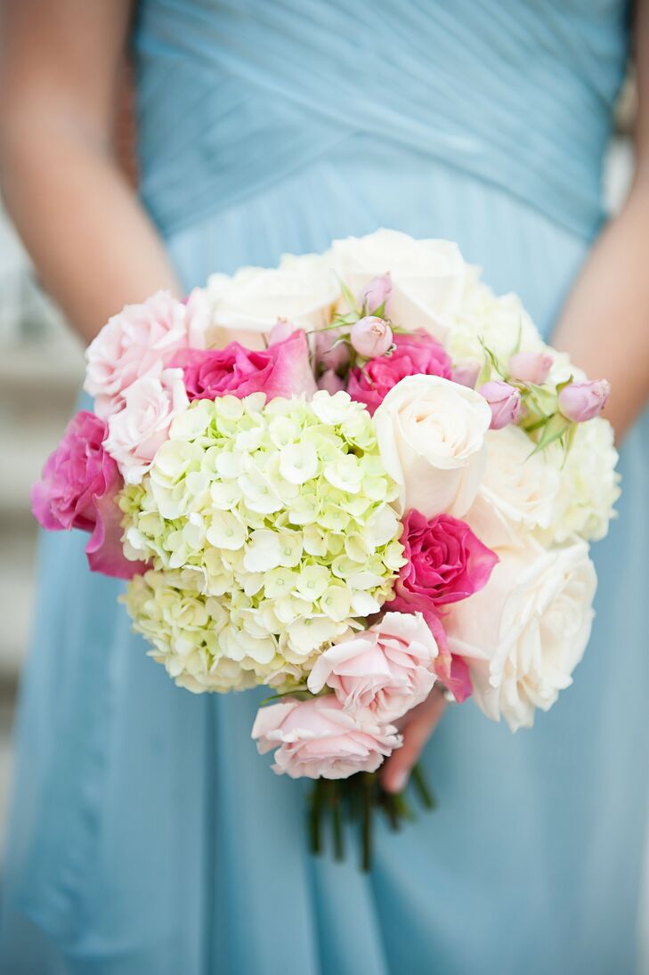 The bridesmaids carried pink and white bouquets full of hydrangeas and roses down the aisle.