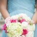 The bridesmaids carried pink and white bouquets full of hydrangeas and roses down the aisle.