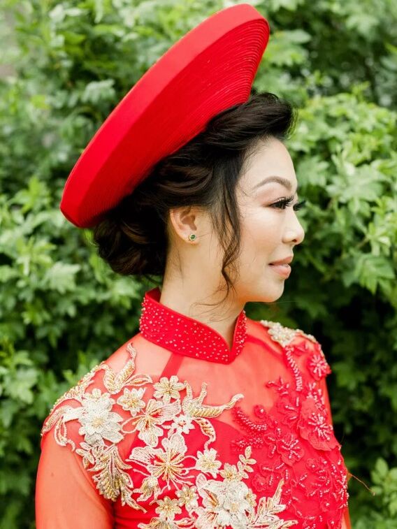 Bride wears a traditional headpiece. 