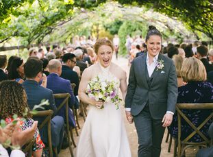 Fifteen months after they got engaged on a mountain peak in New Zealand, Cassie Ludwig (28 and a doctor) and Lindsey Barnhart (32 and a lawyer) invite