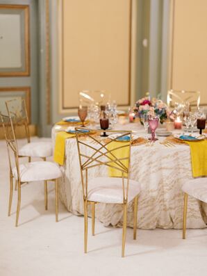 Round Dining Tables With White-and-Gold Linens, Yellow Napkins, Low Centerpieces