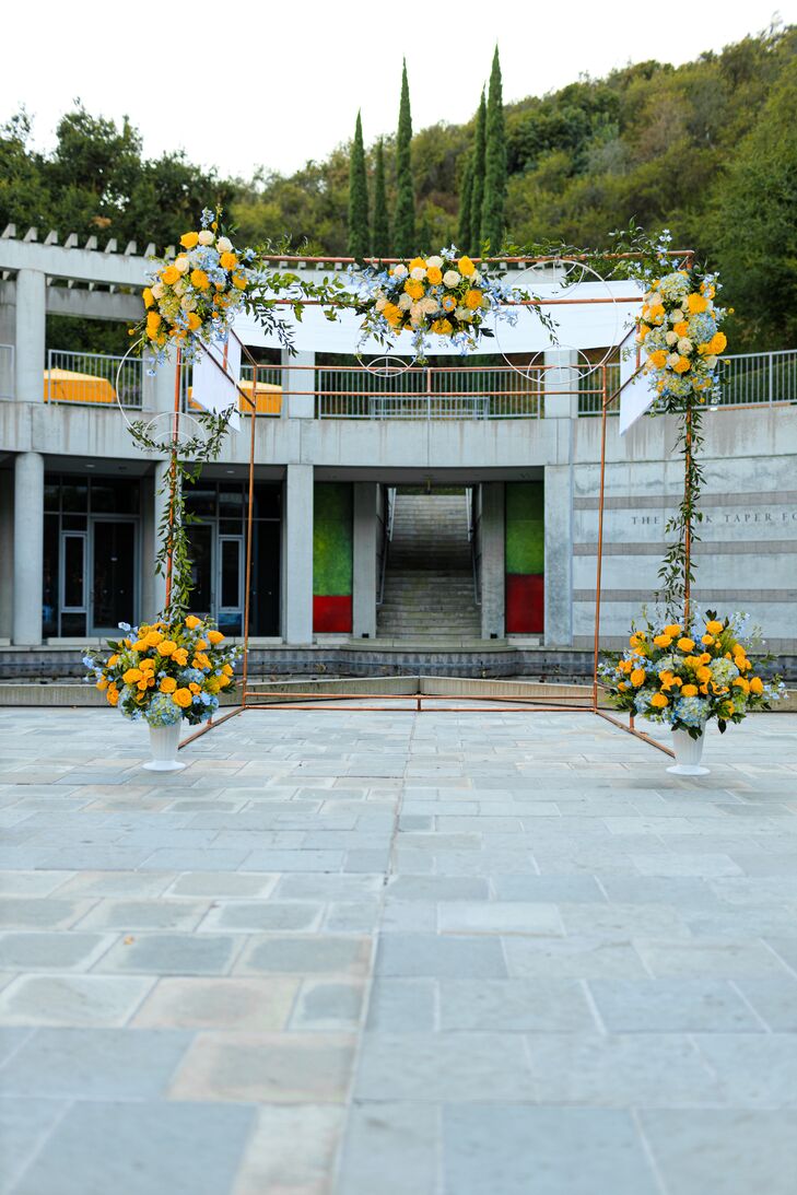 Modern Metal Chuppah with Whimsical Yellow Flower Arrangements