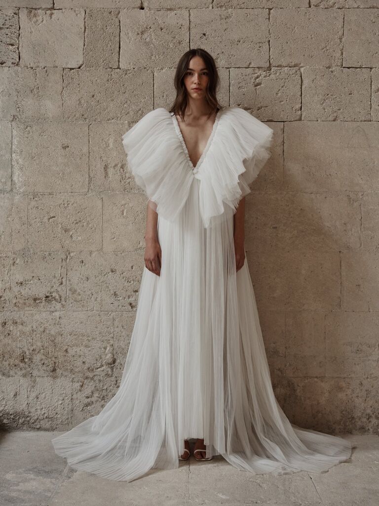 Flowy avant-garde wedding dress by Christie Nicole. 
