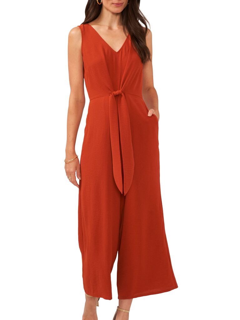 Model wearing a rustic jumpsuit with a tie and pockets