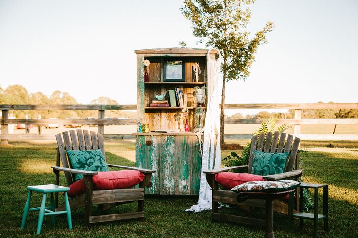 The reception seating spilled over into the backyard, where outdoor rooms were set up—complete with velvet couches and lamp lighting.