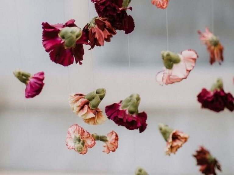 A hanging purple carnation garland