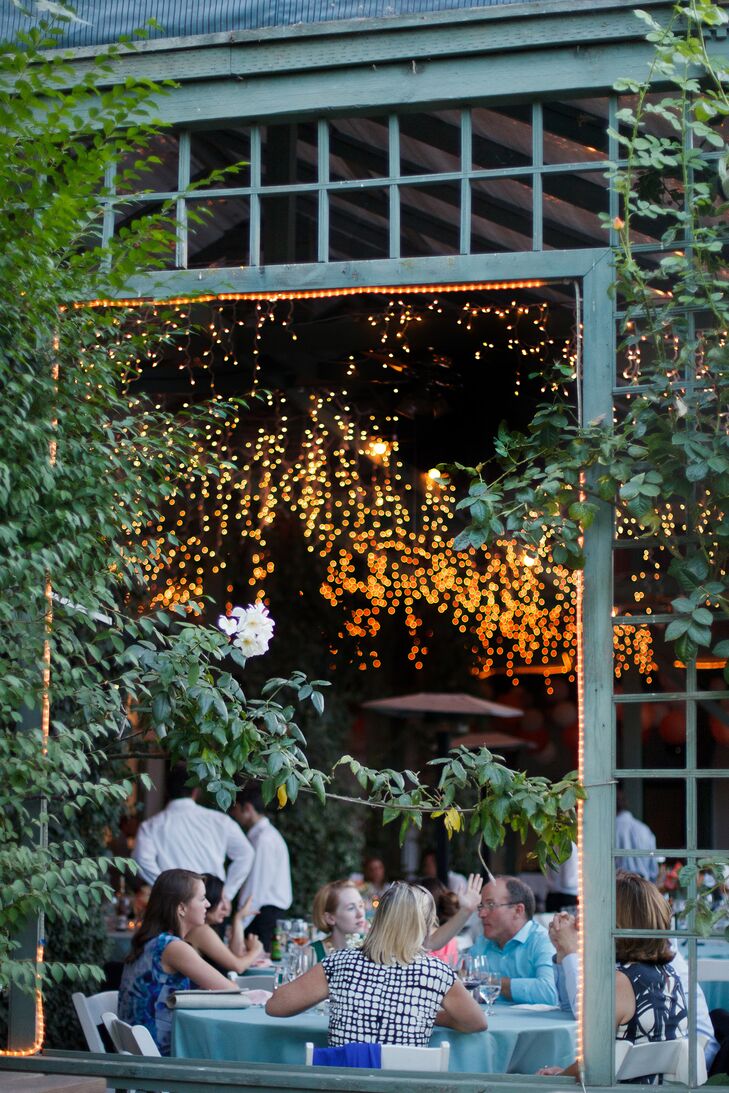These yellow to orange ombre hanging string lights were a fun and classy way to light the reception venue as it got darker. Rather than bold ceiling lights, these lights provided a romantic atmosphere well into the night.