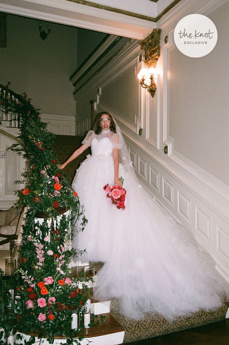 Influencer Caroline Vazzana worked with fashion designer Christian Siriano to custom-create her wedding dress. The end result was a stunning tulle ball gown with a corset bodice and sheer puff sleeves.