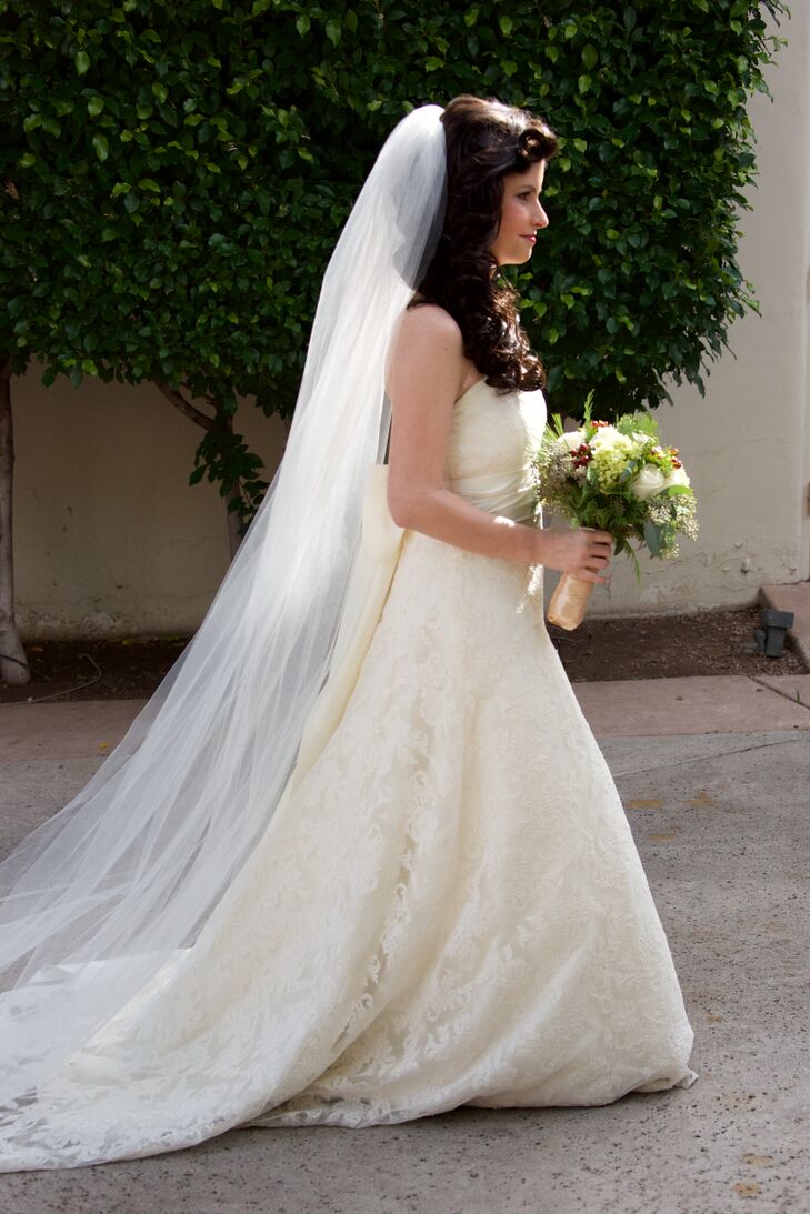 Camelia wore an elegant Jenny Yoo lace wedding dress with a cathedral veil.