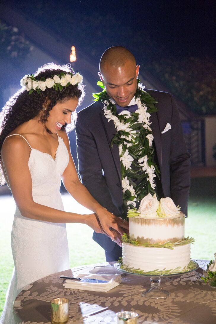 Bethany and Leonard cut into a vanilla sponge cake with lemon filling and buttercream frosting, also made by the resort's chefs.