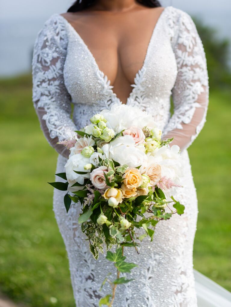 classic cascading bouquet with white peonies, pink roses and ivy vines