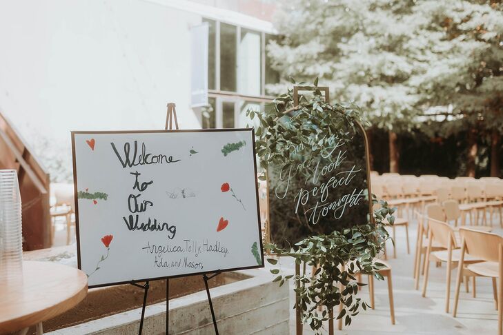 Welcome Sign Made by the Couple's Children, Greenery Around Sign for Rustic Wedding