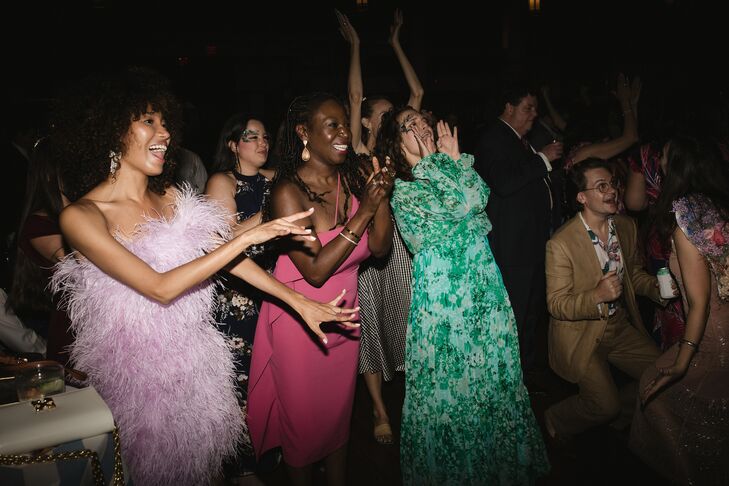 Guests in Stylish, Fashionable Wedding Attire Dance and Shout