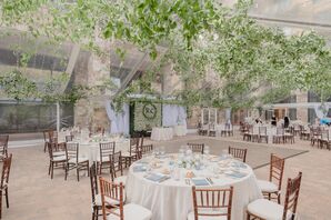 Wedding Reception Decorated With Greenery and Wood Chiavari Chairs