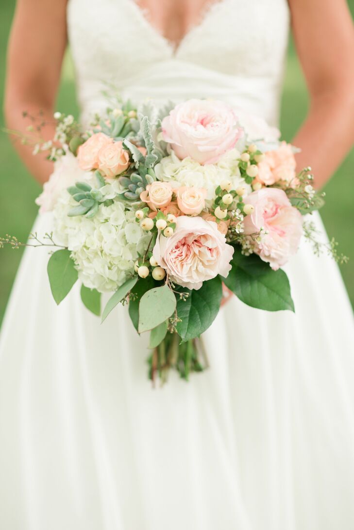The bridal bouquet was a soft mix of roses, succulents, hydrangeas, dusty miller, seeded eucalyptus and hypericum berries.
