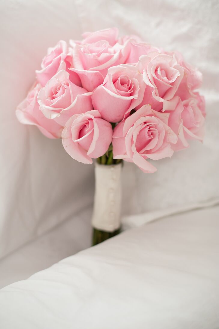 Kristine's bouquet of light pink roses perfectly matched the wedding's soft and romantic theme.