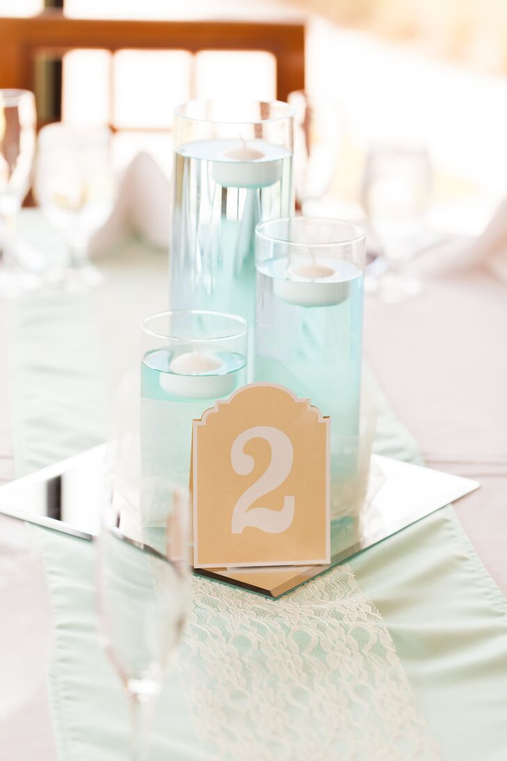 Cami and Tarik even added a sentimental touch into their reception at Eagle Creek Golf Club in Orlando, Florida. Each table was lined with a Tiffany blue satin and lace runner made by Cami’s grandmother. A trio of matching blue floating candles on a mirror accent served as the centerpiece.