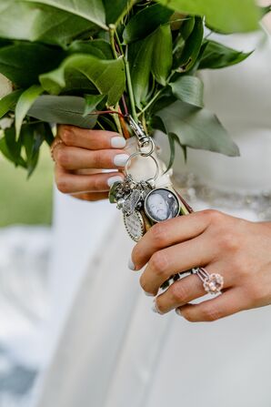 Photo Lockets and Charms Wrapped Around Wedding Bouquet