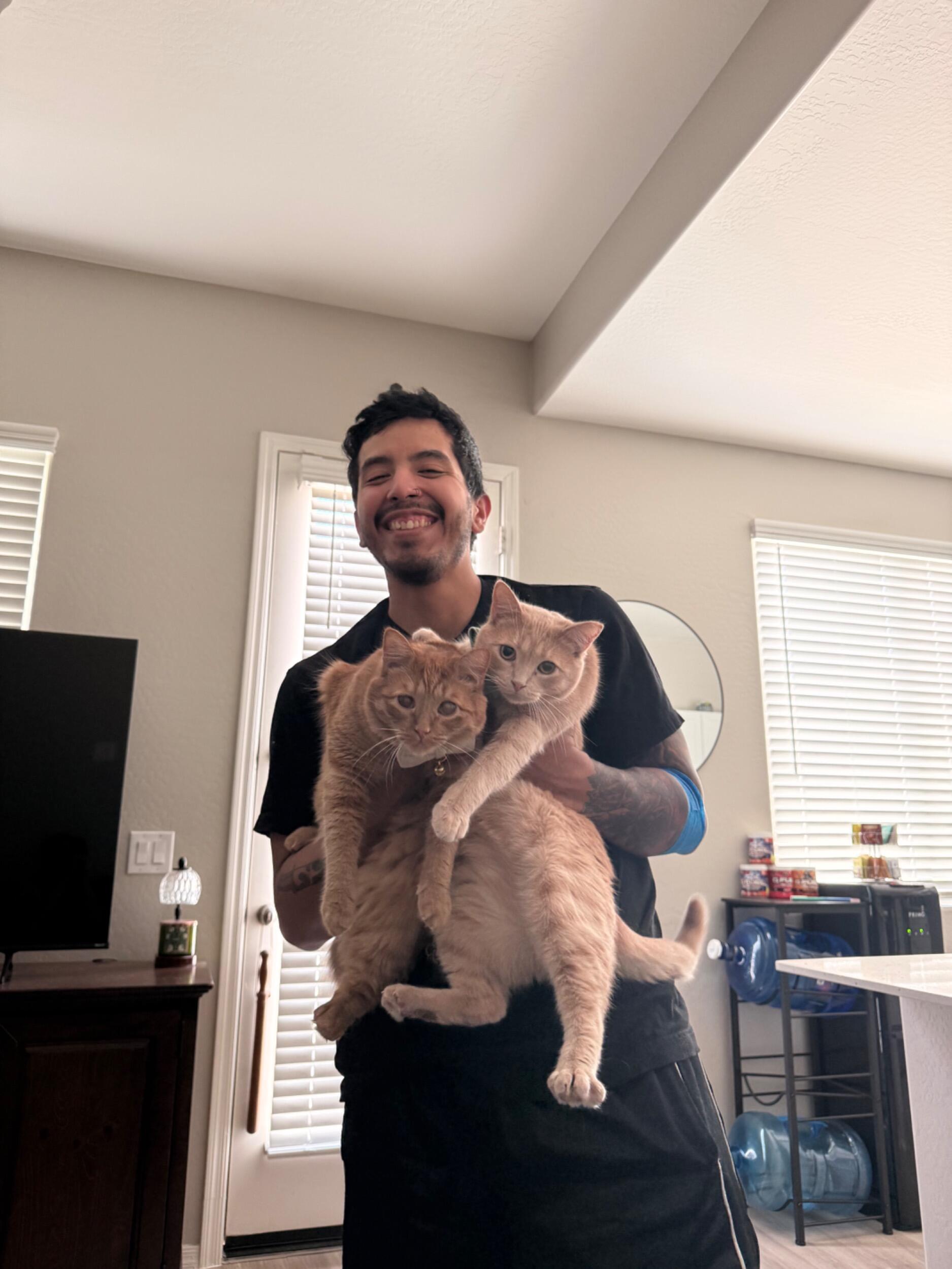 Nothing more wholesome than a wonderful man and his cats. Look at this proud cat-dad! Those poor boys look like they’re in trouble. They probably were, but it was adorable.