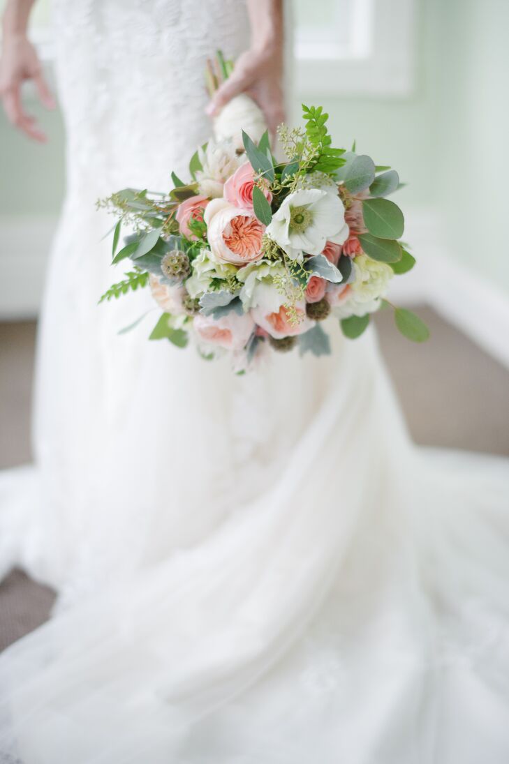 Erica carried a hand-tied lush bouquet of blush garden roses, white anemone, dusty miller, scabiosa pods and eucalyptus down the aisle. “The bouquet was tied with an ivory satin wrap and my maternal great grandmother’s cameo was pinned to the wrap,” says Erica. “It was very special and sentimental to my mother and myself.”
