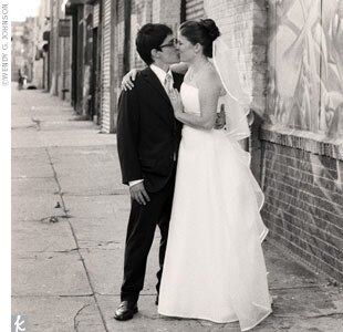Jessi found her strapless organza gown on her very first shopping excursion, to David's Bridal. The gown had three satin bands at the waist and a satin-edged apron back. Her mother made the soft organza veil with satin trim.