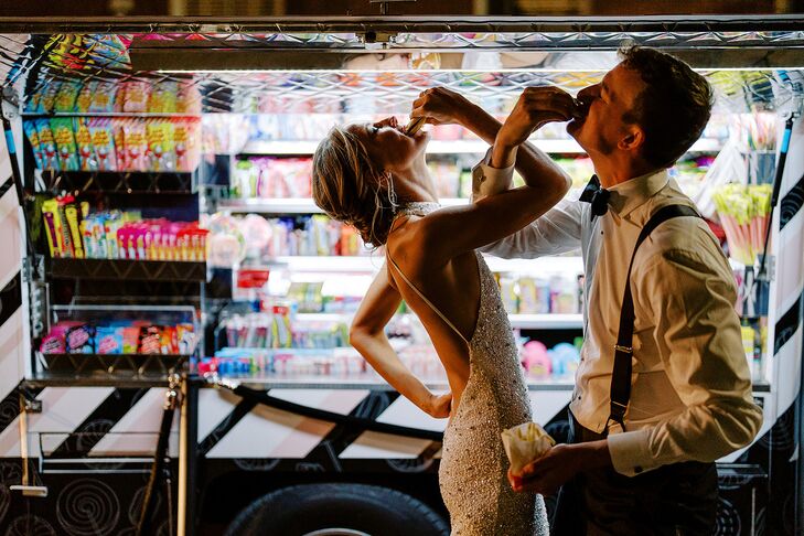 Bride and Groom Twisting Arms Around One Another and Taking a Drink Together