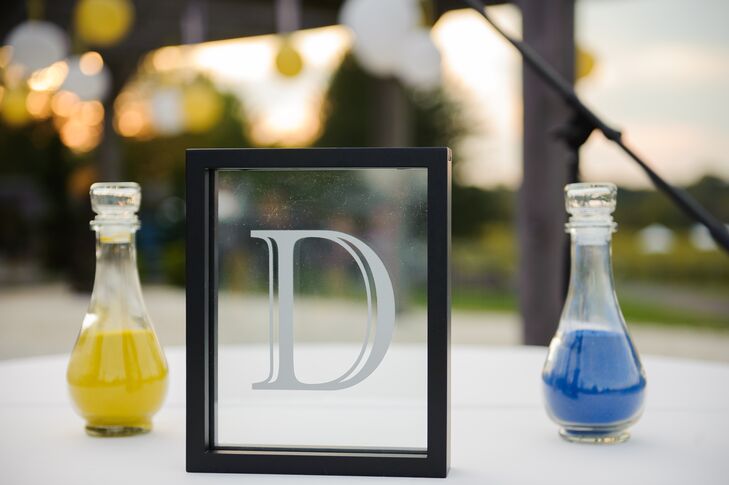 The couple performed a romantic sand pouring ceremony during their ceremony.