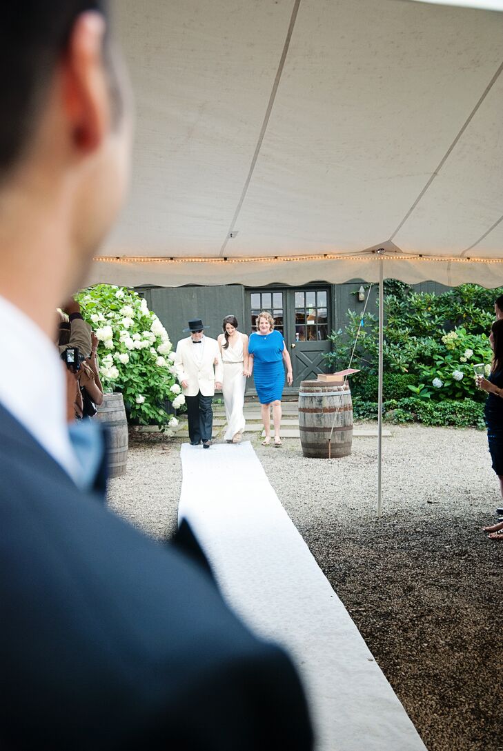 The space was beautifully framed with an old stone wall on one side and rustic structures on the other.
