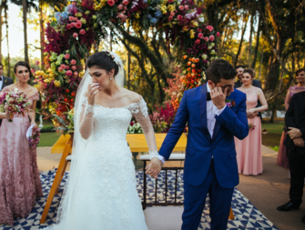 Bride and groom crying walking away from altar