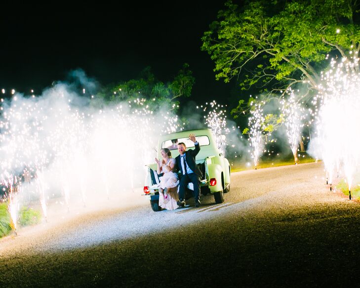 After Paige and Matt's sparkler exit, they hopped onto the back of their friend's vintage truck and headed down the road. As they approached the exit of Pecan Springs Ranch in Austin, Texas, they got an unexpected treat: fireworks. "We were completely surprised and in awe," Paige says. "It was the perfect ending to a perfect night."