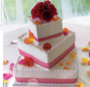 Sweet-toothed guests could indulge in the buttercream-iced wedding cake that included a strawberry tier made using Travis' grandmother's special recipe.