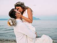Bride and groom kissing at destination wedding