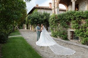 Bride in Gown and Catherdral-Length Gown and Groom in Light Teal Suit, Italian Courtyard