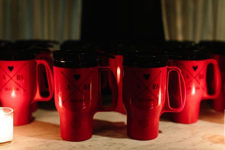 "We wanted wedding favors that would be useful beyond just our wedding day," Allison says of the red travel mugs printed with their custom wedding logo. To send guests off at the end of the night, a hot cocoa station was set up with steaming hot chocolate and homemade marshmallows.