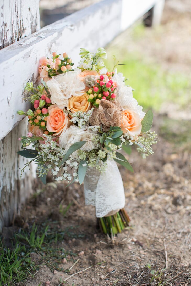 Talia could not get enough of the flower arrangements created by the wedding day's florist, Down The Aisle By Maria. Maria created Talia's bouquet with roses, baby's breath and berries, along with lace and burlap touches that matched the country style of the wedding.