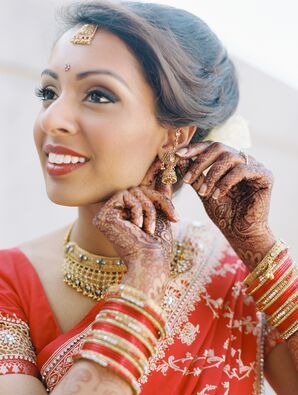 Bride in Red and Gold Jewelry and Henna