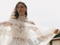 Romantic lace wedding gown with high neck and tulle jacket