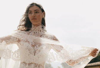 Romantic lace wedding gown with high neck and tulle jacket