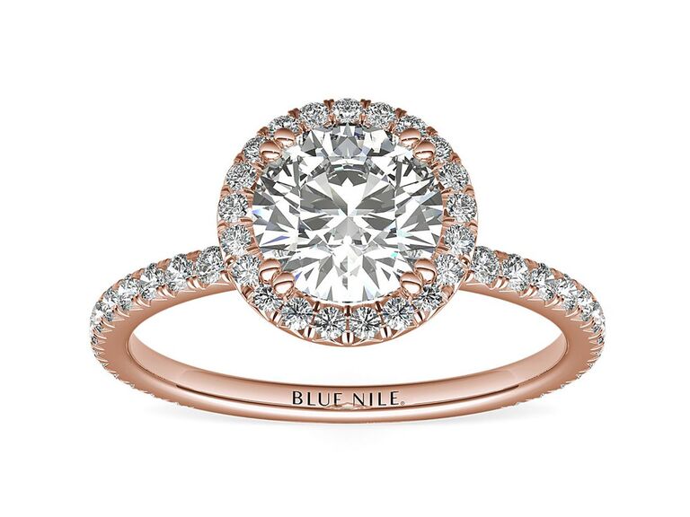 blue nile rose gold engagement ring with round diamond center stone claw prongs round diamond halo and rose gold round diamond band